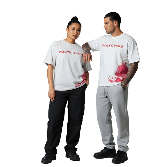 Two people wearing white t-shirts with red text and graphics on a gray background
